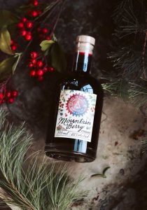 Mountain Berry Cordial with Christmas holly.