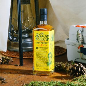 The Mellow Fellow Corn Whiskey with camping props.