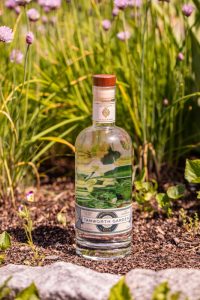 tamworth garden gin in front of flowers